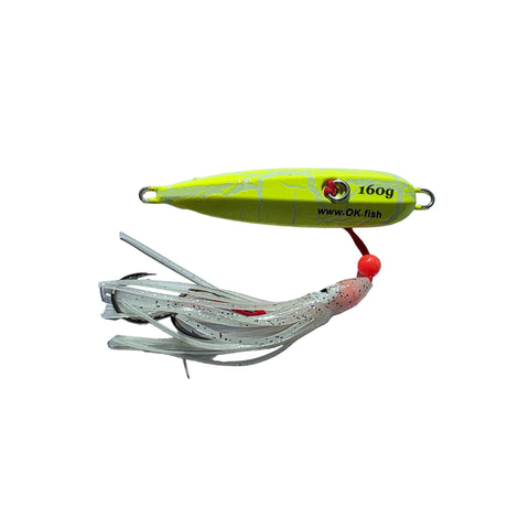 Two fishing lures on a gray surface, one yellow and one white with red accents.