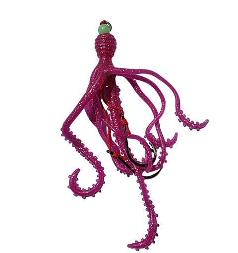 Pink squid-shaped fishing lure on a light gray background