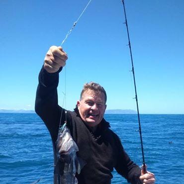 Captain Gubby with a nice blue cod - OK.fish