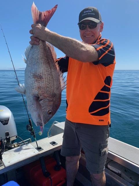 Lloyd with his first ever snapper on slow jigs - OK.fish