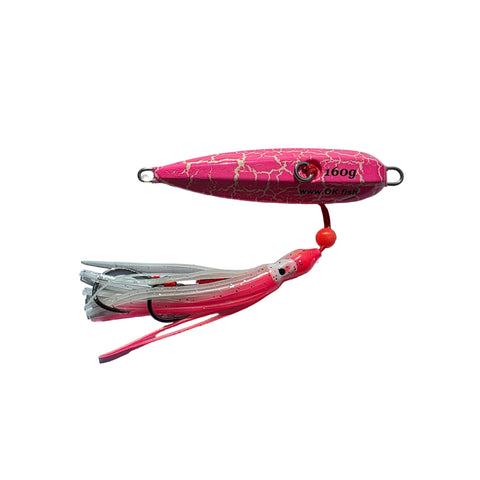 Pink fishing lure on a gray surface