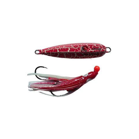 Red and white fishing lure on a light gray background
